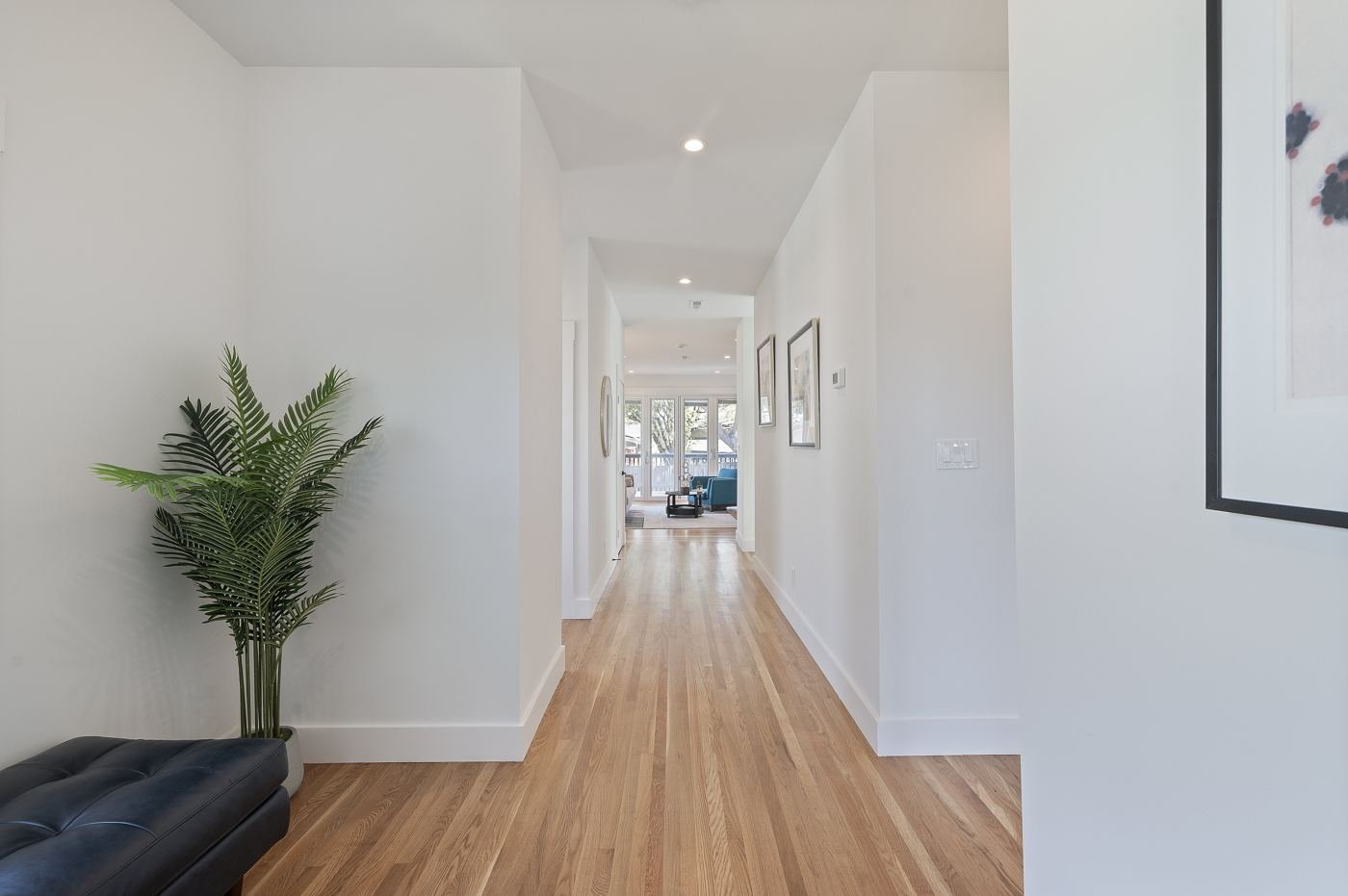 Entry hallway with gleaming hardwood
